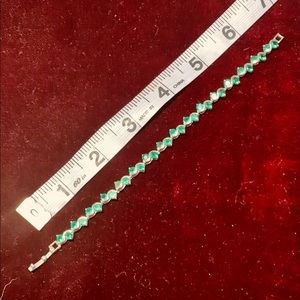 Man-made Emerald gems tennis bracelet.